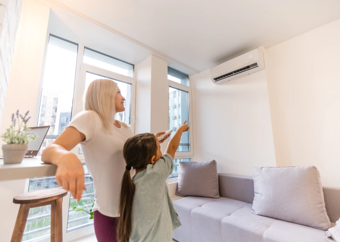 happy-family-air-conditioner-mom-holding-remote-control-switch-conditioning-living-room-adjust-comfort-temperature-daughter-climate-system-modern-home